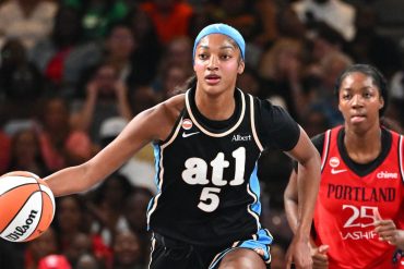 Angel Reese of the Atlanta Dream dribbles during a 2026 WNBA game