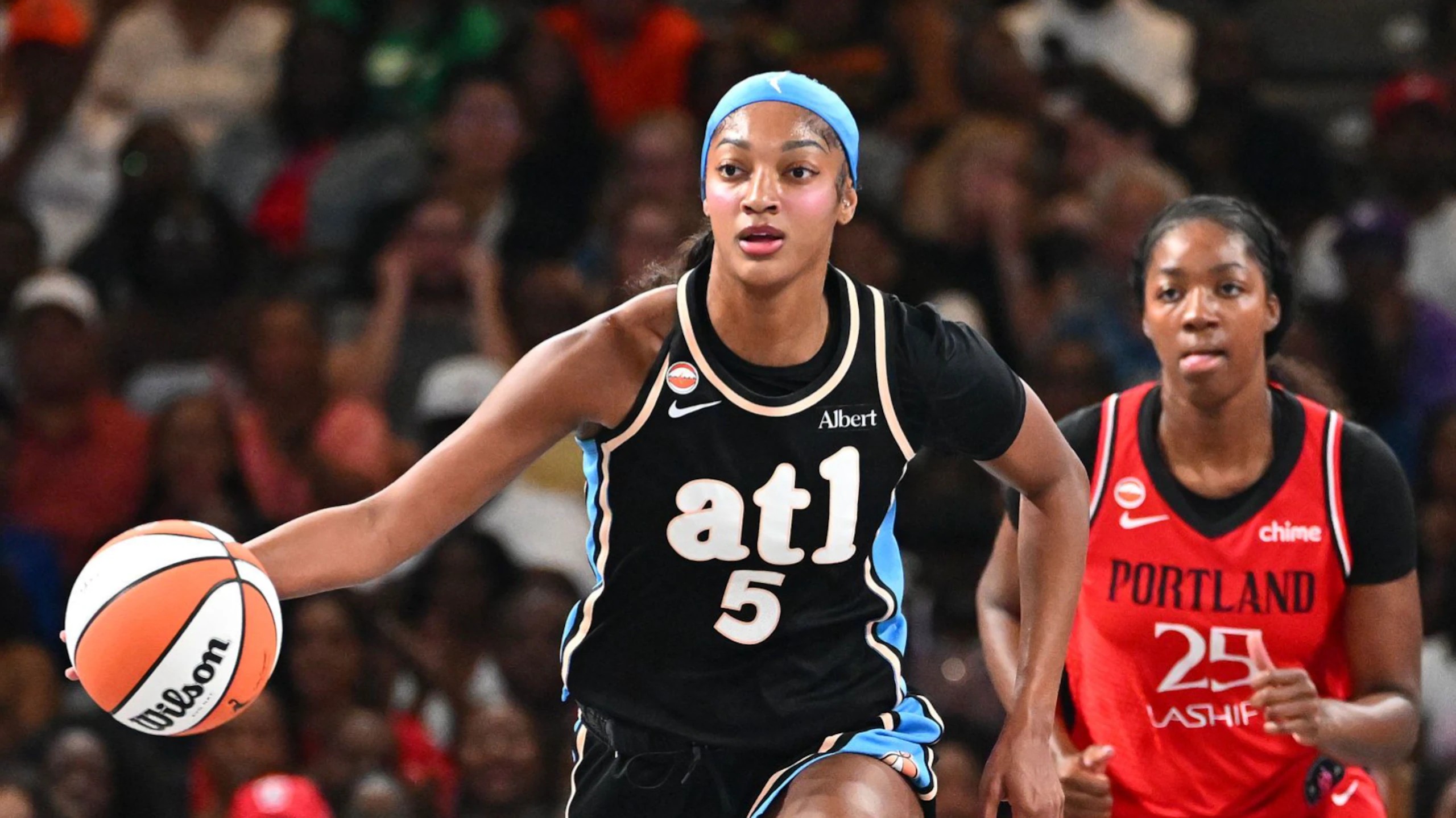 Angel Reese of the Atlanta Dream dribbles during a 2026 WNBA game