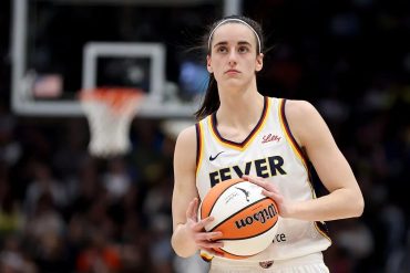 Caitlin Clark holding the ball during an Indiana Fever game in 2026