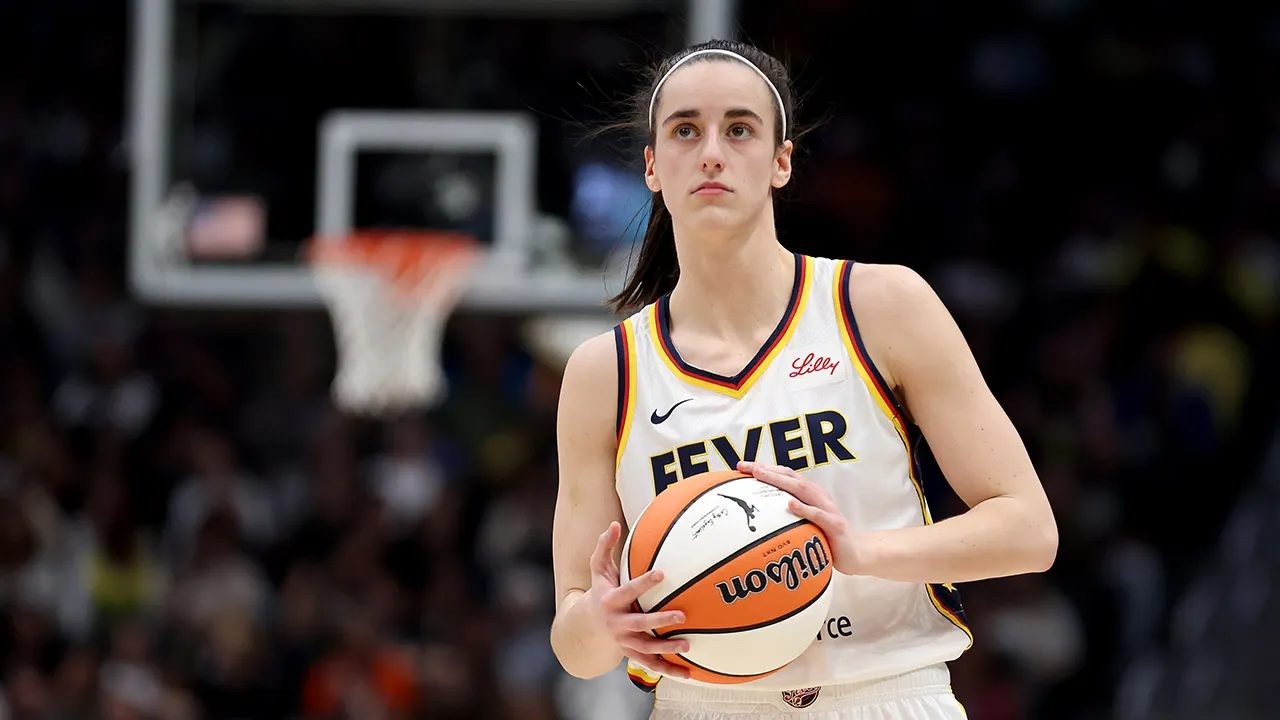 Caitlin Clark holding the ball during an Indiana Fever game in 2026