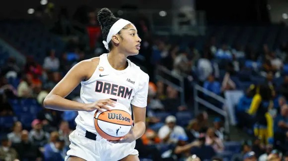 Angel Reese holding a basketball during an Atlanta Dream game in 2026