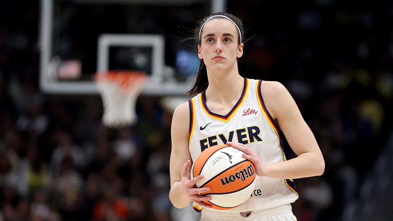 Caitlin Clark in her Indiana Fever uniform handling the ball during the 2026 WNBA playoffs