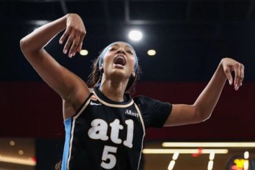 Angel Reese of the Atlanta Dream drives against the New York Liberty in semifinal Game 1
