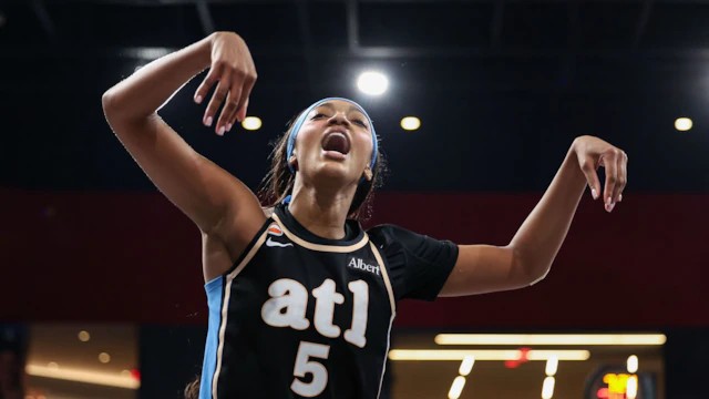 Angel Reese of the Atlanta Dream drives against the New York Liberty in semifinal Game 1