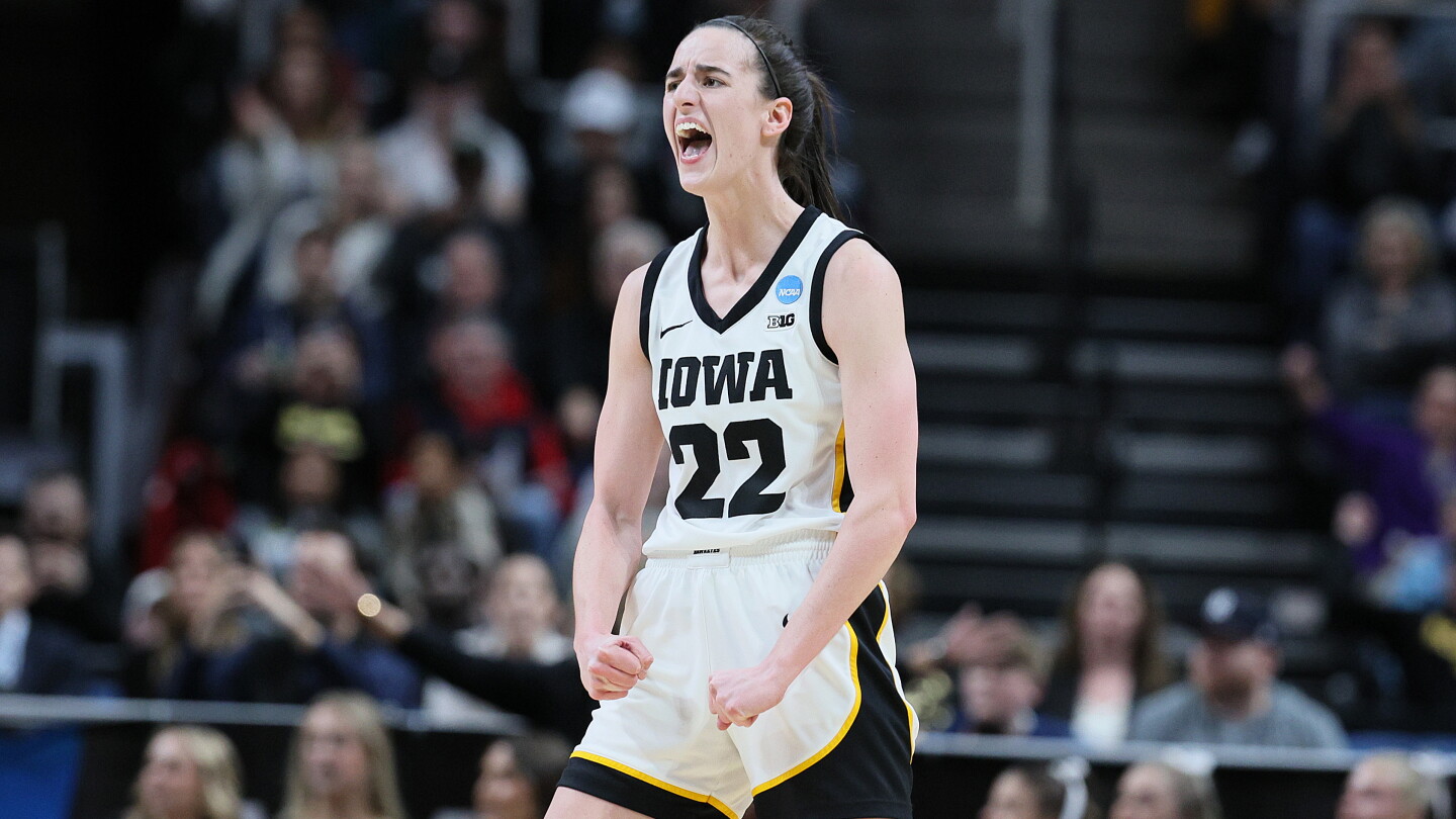 Caitlin Clark celebrates in her Iowa Hawkeyes jersey; she returned to Iowa City as ESPN's College GameDay guest picker on October 3